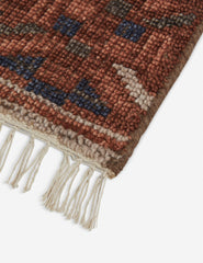 Traditional Bokhara-style area rug.